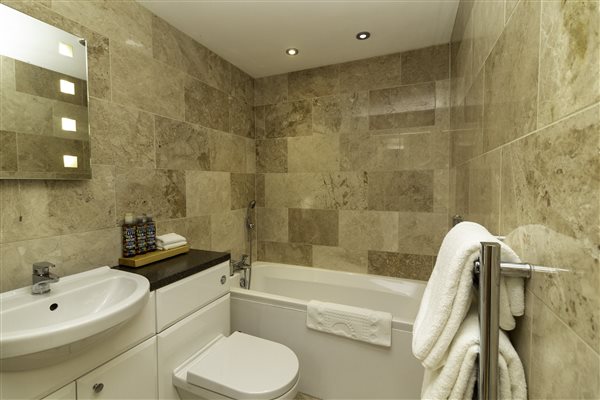 Twin bathroom with bath